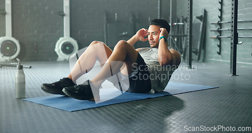 Image of Exercise abdomen training, man and fitness body workout in gym. Young Asian person athlete, healthy sports wellness goal and core muscle power crossfit motivation on yoga mat in health studio