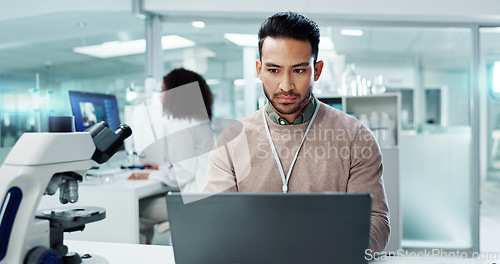 Image of Man, laptop and lab for futuristic medicine or science or online internet for research, microscope or study. Male person, innovation and biotechnology project for investigation, cure or development