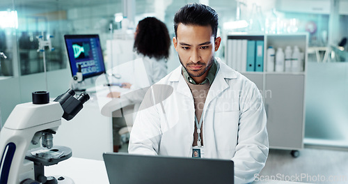 Image of Scientist, man and reading computer for laboratory test, typing report or medical results of DNA at night. Asian expert thinking on computer for science research, biotechnology and molecule analysis