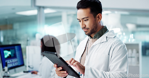 Image of Scientist, man and tablet for laboratory research, DNA analysis and results in medical study at night. Young science expert or people in biotechnology, digital software or computer for test checklist