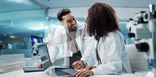 Image of Scientist, teamwork and happy with laptop in laboratory for test breakthrough, pharmaceutical review or success. Science, collaboration or technology for research, discussion and digital analysis