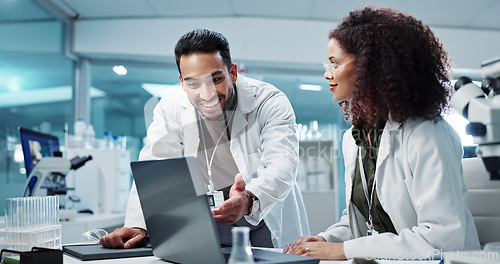 Image of Scientist, teamwork and happy with laptop in laboratory for test breakthrough, pharmaceutical review or success. Science, collaboration or technology for research, discussion and digital analysis