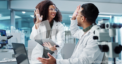 Image of Science, teamwork and high five with laptop in laboratory for test breakthrough, pharmaceutical review or excited. Scientist, collaboration or mentor for research success, talking or digital analysis