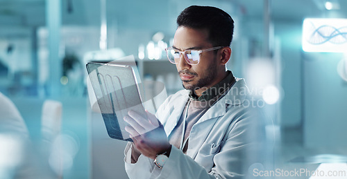 Image of Tablet, thinking or scientist with research in laboratory for a chemistry report or medical test feedback. Asian man, person typing or science update for online medicine development news on website