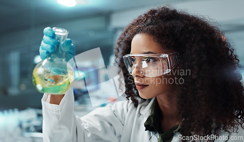 Image of Scientist, research or woman with liquid in test tube for analysis, medical testing and analytics in lab. Biotechnology, healthcare or science person with medicine, sample and vaccine in glass vial