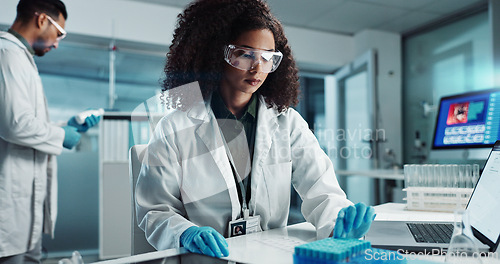 Image of Woman, scientist or blood vial for exam in laboratory, healthcare or pathology to label on test tube. Biotechnology, pharmaceutical and laptop by doctor and online scientific results in phlebotomy