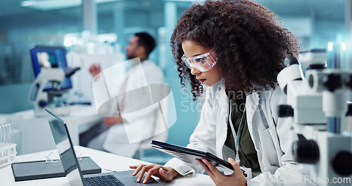 Image of Laptop, woman or scientist in laboratory with tablet or research for chemistry report or medical test. Doctor, person typing or science update for online medicine development or virus news on website