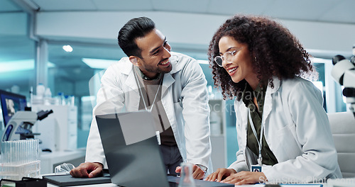 Image of Scientist, teamwork and happy with laptop in laboratory for test breakthrough, pharmaceutical review or success. Science, collaboration or technology for research, discussion and digital analysis