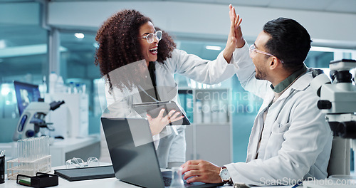 Image of Science, teamwork and high five with laptop in laboratory for test breakthrough, pharmaceutical review or excited. Scientist, collaboration or mentor for research success, talking or digital analysis