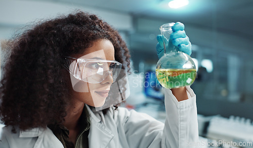 Image of Scientist, woman and chemical with glasses in laboratory for chemistry experiment, test sample or research. Science, person and liquid inspection for clinical analysis, expert investigation and study
