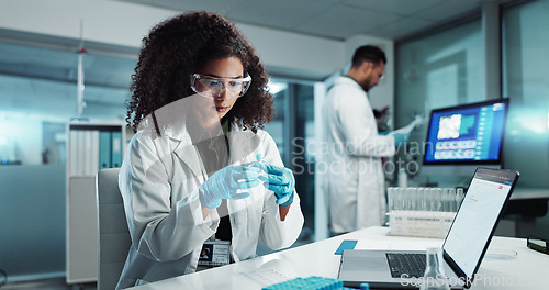 Image of Woman, scientist or blood vial for exam in laboratory, healthcare or pathology to label on test tube. Biotechnology, pharmaceutical and laptop by doctor and online scientific results in phlebotomy