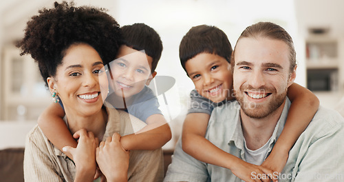 Image of Love, hugging and face of a family on a sofa for relaxing, bonding and spending time together. Happy, smile and portrait of cute boy children embracing their young interracial parents at modern home.