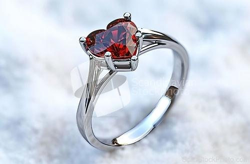 Image of Red Heart Shaped Ring on White Surface