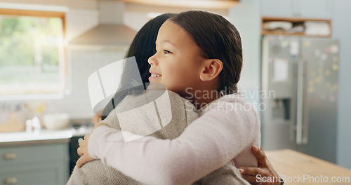 Image of Love, mom and girl in a hug in family home with support, trust and bonding in kitchen or happy childhood memory of daughter. Smile, face and kid in embrace with mother, woman or together with mommy