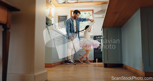 Image of Support, love and ballet girl bonding with father in a kitchen together, excited and playing as a dancer pr ballerina. Tutu, dad and man dancing with kid with motivation or happiness in house or home