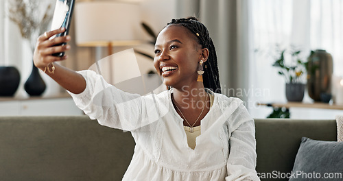 Image of Smile, selfie and black woman with peace sign, funny face and relax on sofa in living room. V hand, picture and happy African person or influencer at home on couch on social media with tongue out