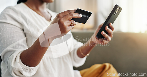 Image of Woman, credit card and hands with phone for ecommerce payment, online shopping and fintech at home. Closeup, mobile banking and finance for sales, password and code for wealth to upgrade subscription