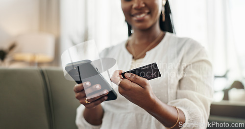 Image of Hands, woman and credit card with smartphone on sofa for online shopping, payment and fintech at home. Closeup, mobile banking and finance for sales, password and code for ecommerce, money or savings