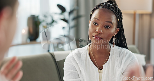 Image of Psychology, mental health and empathy with a black woman therapist talking to a patient in her office. Support, consulting and trauma with a young psychologist listening to a client in grief therapy