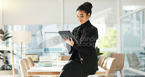 Image of Happy woman in office with tablet, email or social media review for tech business, schedule or agenda. Smile, digital app and businesswoman networking online for market research, website and report.