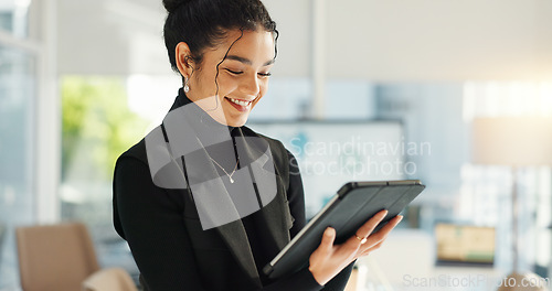 Image of Happy businesswoman in office with tablet, email or social media for business feedback, schedule or agenda. Smile, digital app and woman networking online for market research, web review and report.