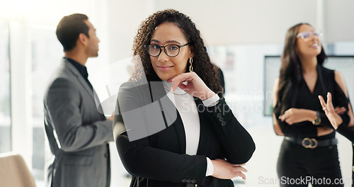 Image of Face, smile and confident business woman in the office with an employee team for collaboration or leadership. Portrait, corporate and happy young professional employee in the workplace with her team