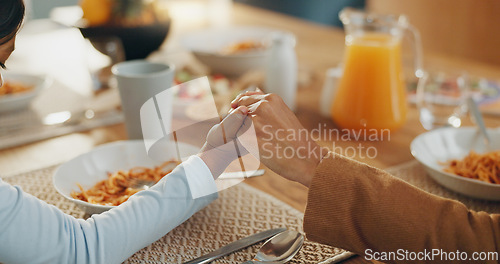 Image of Hands, food and prayer with family eating together, parents and child with faith, gratitude and God, food and nutrition. Health, wellness and prayer with hungry people at home, worship and trust