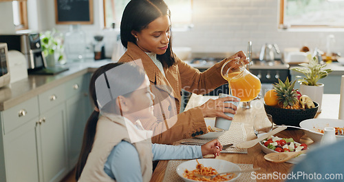 Image of Woman, girl and juice with family and eating together in kitchen, nutrition and bonding with food. People at home, hungry and female child excited with drink and wellness happy with dinner meal