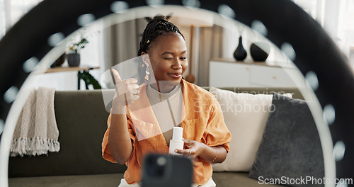 Image of Video, influencer and black woman doing skincare for tutorial on social media or the internet. Dermatology, happy and young African female person filming or live streaming facial routine at home.