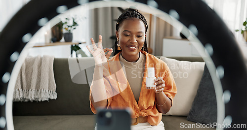 Image of Video, content creator and black woman doing skincare for tutorial on social media or the internet. Dermatology, happy and African female influencer filming or live streaming face routine at home.