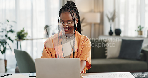 Image of Black woman, typing in home office and laptop for research in remote work, social media or blog in apartment. Freelance girl at desk with computer writing email, website post and online chat in house