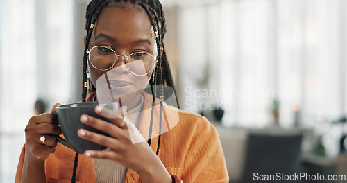 Image of Calm, cup of coffee and black woman in the living room of her modern apartment in the morning. Peaceful, mug and young African female person drinking caffeine or latte in her home on weekend.