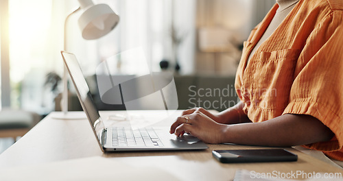 Image of Hands of woman at desk, typing and laptop for remote work, social media or blog post research with in home office. Freelance girl with computer writing email, website or online chat in apartment.