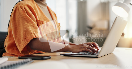 Image of Black woman with laptop, typing and remote work in social media, blog post or online research in home office. Freelancer at desk with computer with email, website review or writing article in house.