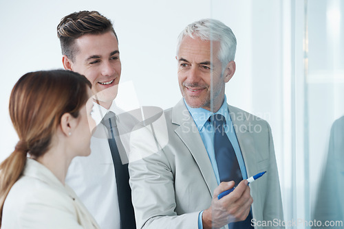 Image of Glass wall, accountant or business people with planning, conversation or brainstorming with a project. Solution, group or manager with employees or teaching with ideas or cooperation with partnership