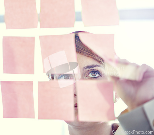 Image of Businesswoman, sticky notes and glass wall for planning, thinking and vision for logistics and ideas. Employee, brainstorming and mockup for meeting, goals and teamwork for project management