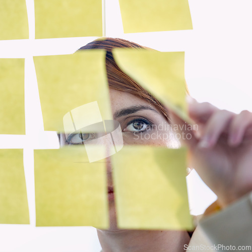 Image of Employee, sticky notes and glass wall for thinking, planning and vision for logistics and ideas. businesswoman, brainstorming and management for meeting, goal and seo with decisions for marketing