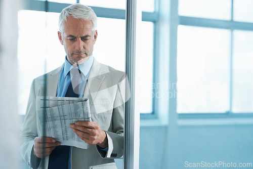 Image of Man, business and reading newspaper with concern as financial consultant for stock market, review or report. Male person, frown and corporate professional for investment problem, trouble or stress