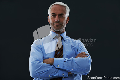 Image of Senior, businessman and portrait or arms crossed in studio with confidence and pride for corporate career or job. Mature, entrepreneur and ceo with face, serious and contemplating on black background