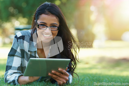 Image of College, woman and portrait with tablet in park for research, project or learning outdoor on campus. University, student and girl streaming online with ebook, education or studying on grass in garden