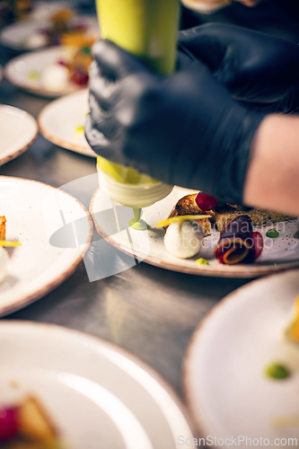 Image of Chef finishing his plate