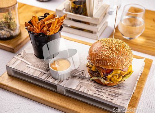 Image of Burger and fried potatoes