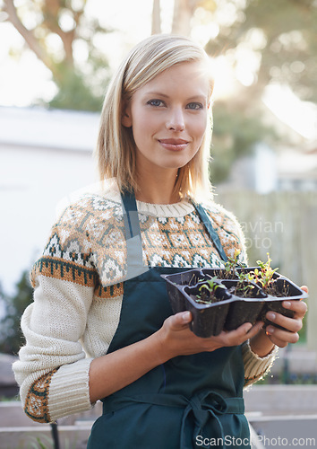 Image of Gardening, seedling and portrait of woman with plants for landscaping, planting flowers and growth. Agriculture, nature and face of person outdoors for environment, ecology and nursery in garden