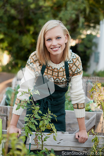 Image of Gardening, backyard and portrait of woman with plants for landscaping, planting flowers and growth. Agriculture, nature and face of person outdoors for environment, ecology and nursery in garden