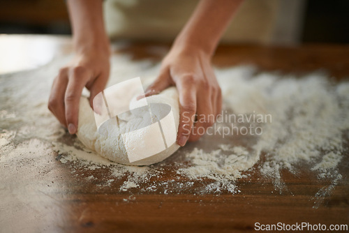 Image of Hands, dough and wheat flour on table at bakery, bread or pizza with meal prep, catering and cooking. Culinary, chef or baker person with pastry preparation, ingredients and food for nutrition