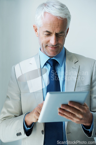 Image of Mature, businessman and tablet for online networking as law attorney as corporate professional, email or reading. Male person, employee and internet in office for connect planning, startup or Canada