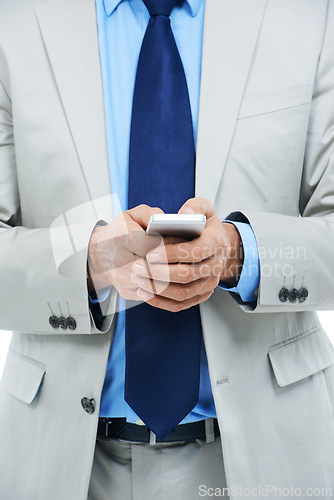 Image of Hands, phone and businessperson in studio for communication, research and typing a message. Closeup, professional and internet or voip for online conversation, email and app on white background