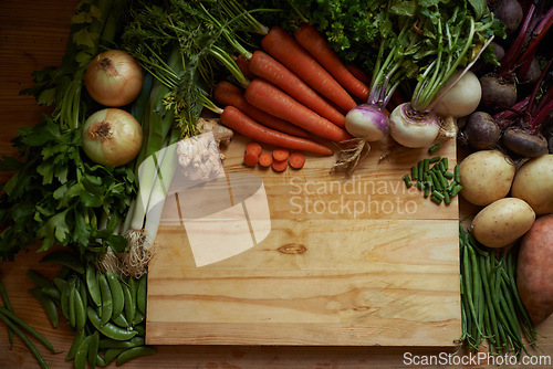 Image of Vegetables, kitchen and empty cutting board for healthy food, cooking and preperation on table above. Culinary, organic and green groceries for vegan or vegetarian recipe and ingredients background