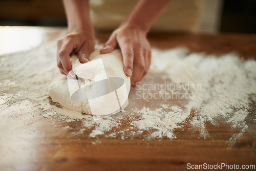 Image of Hands, dough and wheat flour on kitchen counter at bakery, bread or pizza with meal, catering and cooking. Culinary, chef or baker person with pastry preparation, ingredients and food for nutrition