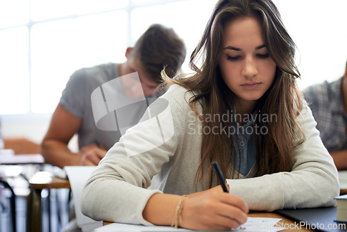 Image of University, writing and woman in classroom with notebook for development in learning, opportunity and future. Education, knowledge and growth for college student in lecture, studying for exam or test